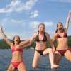 Teenagers jumping into the sea