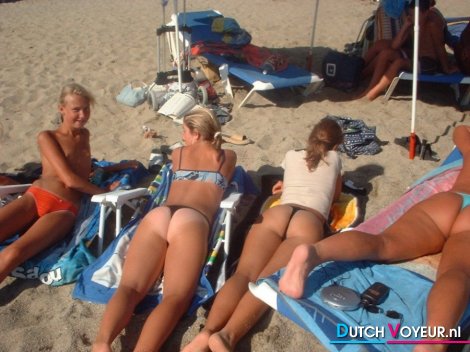 Buttocks and tits lying on the beach